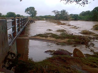 Bubi River - last week flowing over the bridge (& taking animals with it)!